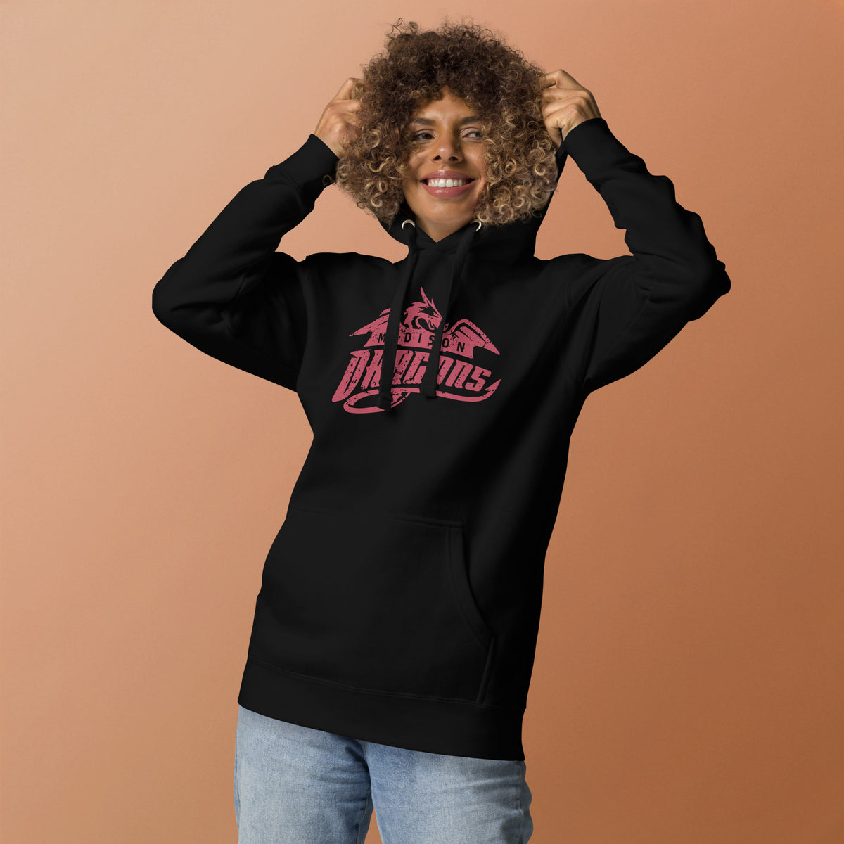 Model wearing Madison Dragons Vintage Hoodie in black with retro college mascot graphic